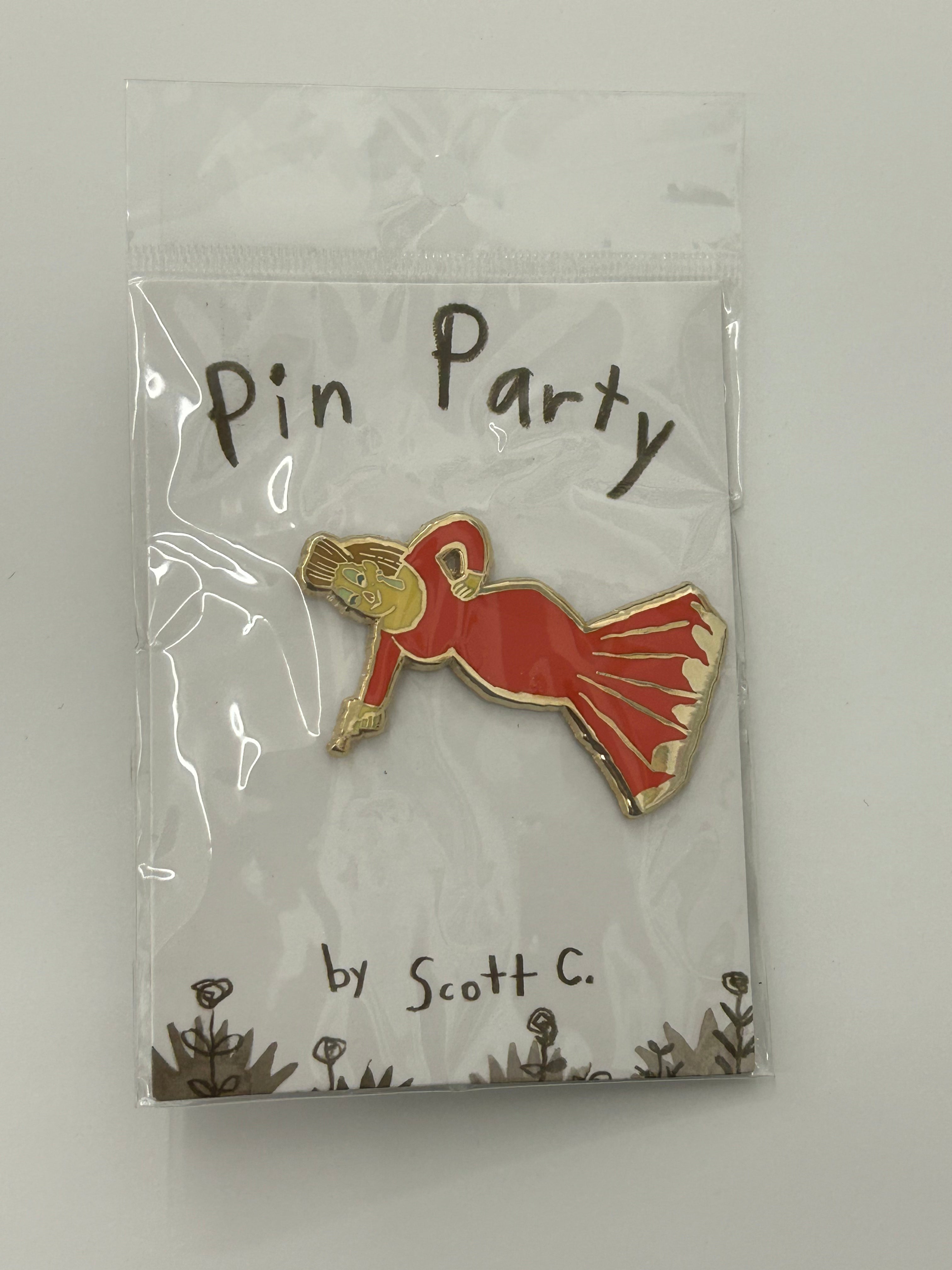 A limited edition hard enamel pin by Scott C., showing a figure in a red dress striking a dramatic pose, attached to a Pin Party backing card with flower illustrations along the bottom.