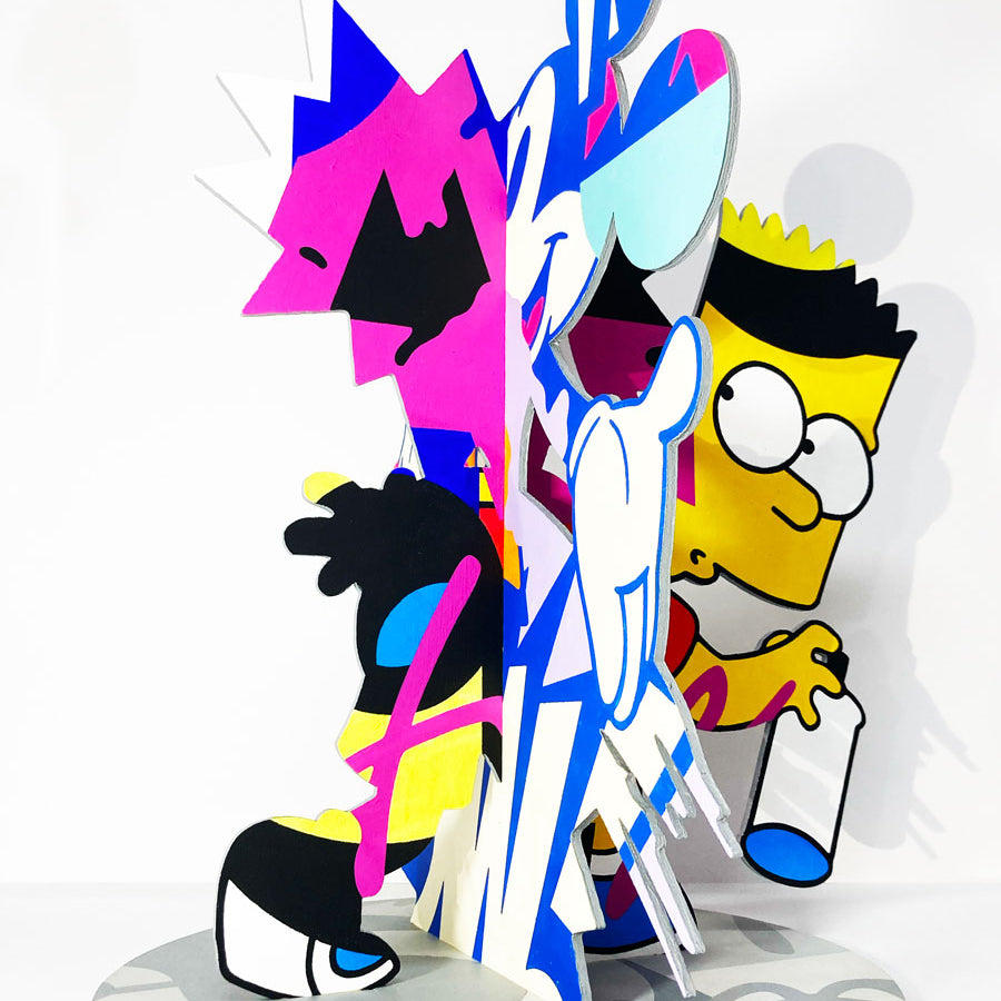 A vibrant abstract sculpture by Greg Gossel for Spoke Art features cartoon-inspired figures, including a Bart Simpson-like character with a spray can, all hand-painted in acrylic on a round base for the 15th Anniversary Show.