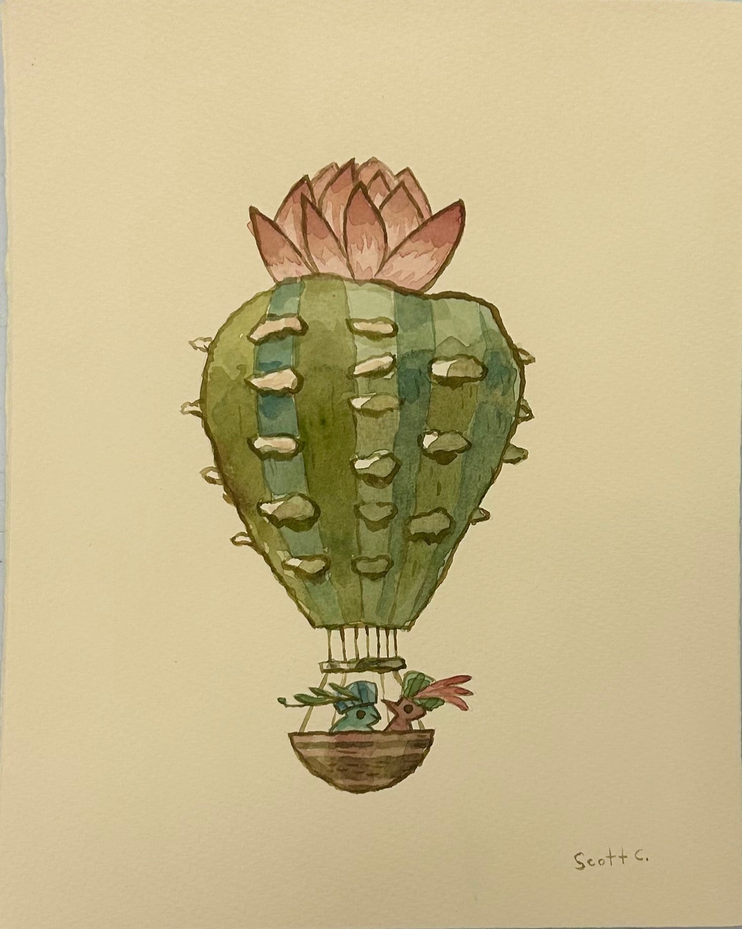 Scott C.s whimsical watercolor Desert Floats features a hot air balloon shaped like a green cactus with a pink flower, two birds in the basket, and the artists signature in the lower right corner.