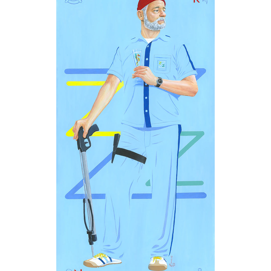 A man in a blue uniform and red beanie, echoing Zissous style, holds a diving helmet against a nautical-themed background. His shirt features an embroidered dolphin alongside letters E, K, N, & B that hint at the Bad Dads IX theme. Brand: Jason Raish.