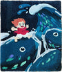 A vibrant Spoke Art rug in hand-dyed wool yarn depicts a red-haired girl in a red dress riding Jeany Ngo Wave-inspired blue fish, with water splashes and two smaller fish accenting the lively design.