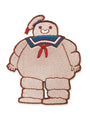 An embroidered patch from Spoke Art featuring a smiling, chubby character in a sailor hat and blue, red, and white outfit—just like the Great Big Puffy Man from Ghostbusters, inspired by artist Scott C.