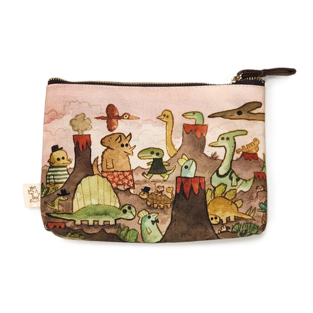This small zippered pouch by Spoke Art features Scott C.’s whimsical Dino Days illustration, displaying colorful cartoon dinosaurs and volcanoes on a light pink and brown background.