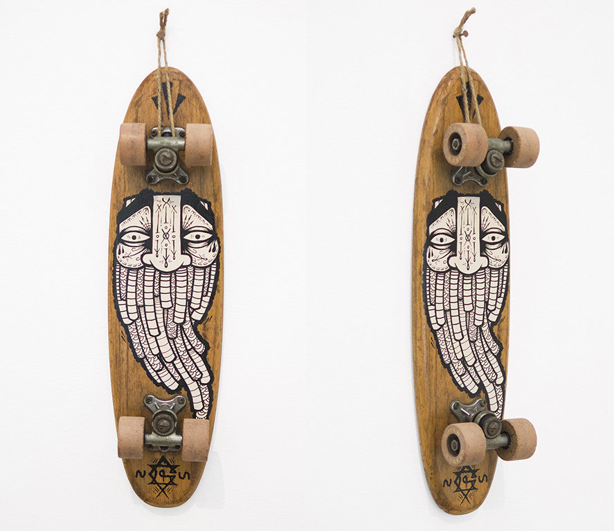 The GATS vintage skateboard features a wooden deck with a black-and-white illustration of a stylized face with long, flowing hair. Set against a plain background, it echoes classic San Francisco art designs celebrated in the market.