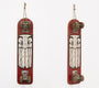 Two vertically-hung skateboard decks, painted red with a white stylized owl design, echo GATS iconic style. Visible truck and wheel assemblies are at each end, suspended by ropes. Ideal for an art market in San Francisco.