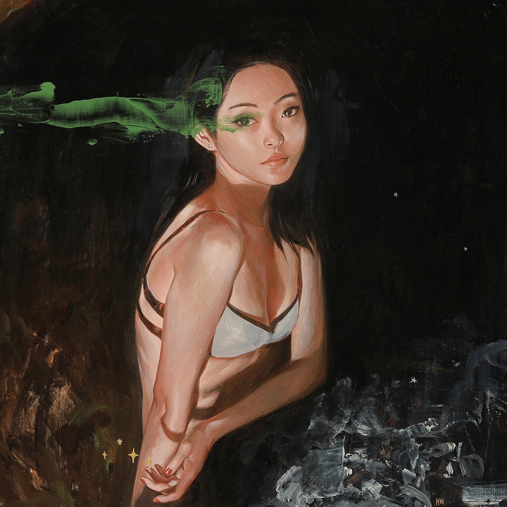 A woman in a white bikini top by Helice Wen poses against a dark, textured background. Her head tilts slightly, with a green streak above her eyes creating a striking visual effect reminiscent of the Northern Lights.
