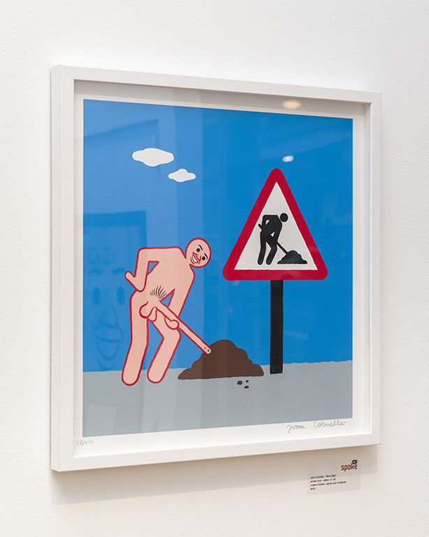 This custom framed artwork by Joan Cornellà showcases a cartoon figure resembling a roadwork sign with someone digging, set against a blue backdrop with white clouds. It captures Cornellàs distinctive style and looks stunning on a white wall.