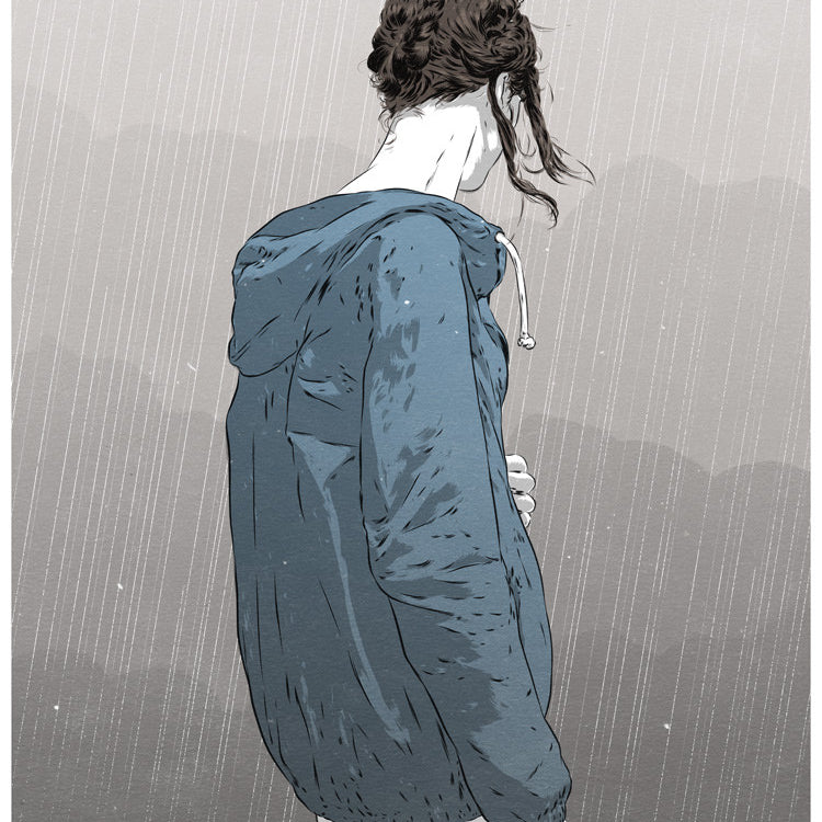 This archival pigment print by Matthew Woodson features an individual with braided hair standing sideways in a heavy rainstorm, wearing a blue hooded jacket. Their head is bowed slightly in contemplation against the backdrop of gray, misty hills.