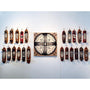 At Art Market San Francisco, a central artwork with a symmetrical, radial design is showcased. This is surrounded by two rows of vintage skateboards, each uniquely customized with intricate acrylic patterns by the brand GATS, creating a visually balanced and artistic display.