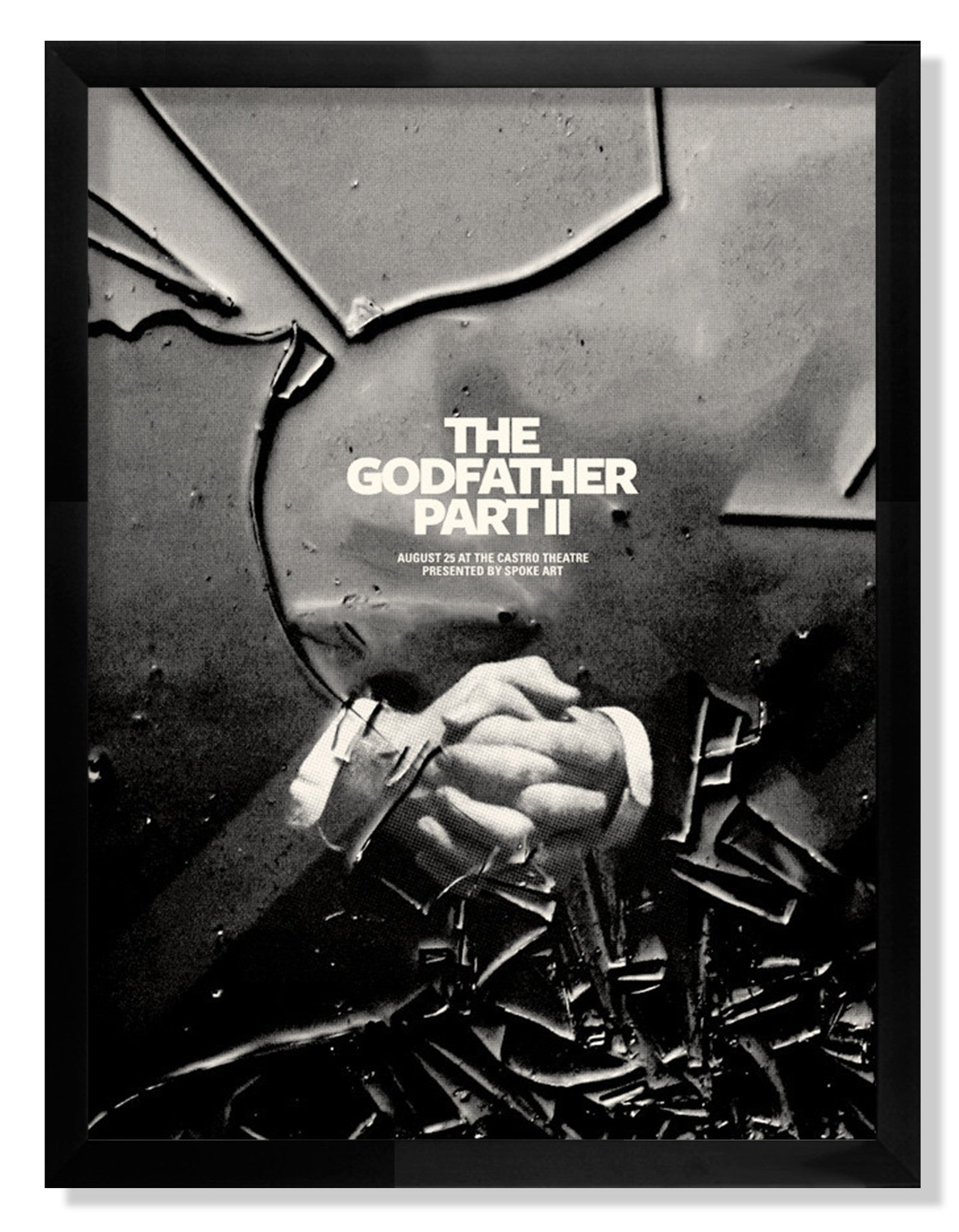 A limited edition The Godfather Part II black and white poster by Brandon Schaefer shows two hands in a firm handshake. Screen print style text announces a screening at the Castro Theatre, set against abstract, cracked patterns.