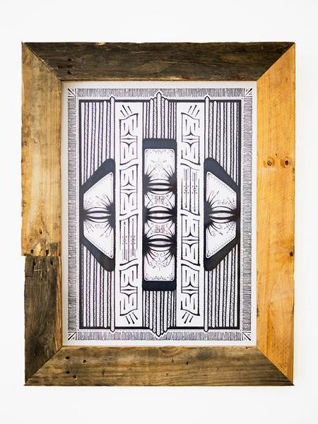 A framed monochrome abstract artwork by GATS on Bristol Board includes symmetrical geometric patterns and intricate lines. The custom rustic frame, crafted from light and dark wood planks, highlights circular, eye-like elements in the unique original illustration.