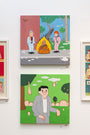Acrylic paintings on canvas decorate the wall. The top shows two figures by a fire, near a fallen tree; the bottom depicts a smiling figure in a suit under fruit-like objects in a park. These artworks reflect Joan Cornellàs playful style.