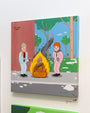 Two figures in winter attire warm themselves beside a burning Buddha statue on a snowy street in this whimsical cartoon styled after Joan Cornellà. Rendered with acrylic on canvas, the scene includes trees and a brick wall backdrop.