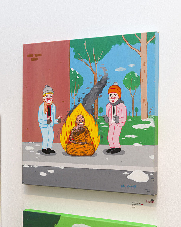 Two figures in winter attire warm themselves beside a burning Buddha statue on a snowy street in this whimsical cartoon styled after Joan Cornellà. Rendered with acrylic on canvas, the scene includes trees and a brick wall backdrop.