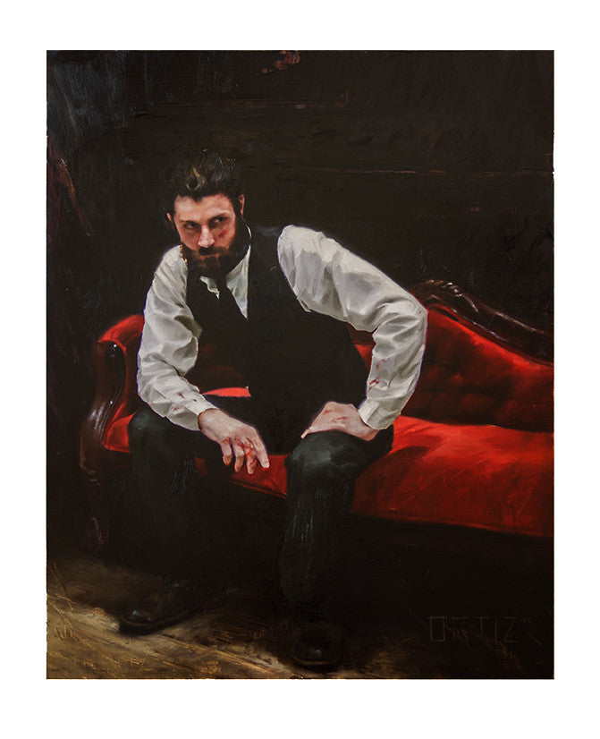 A bearded man sits on a red velvet couch in dim lighting, leaning forward in a white shirt and dark vest. His contemplative expression suggests hes pondering the themes of Rigidum by Karla Ortiz, immersed in introspection.