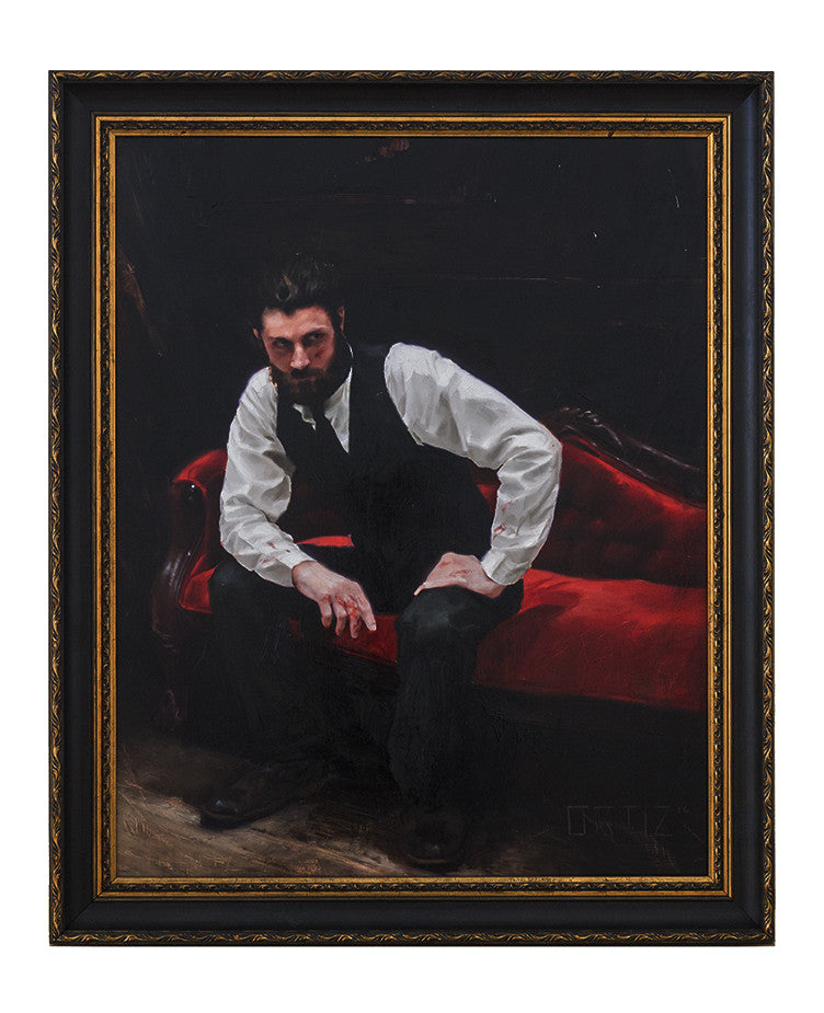 The framed painting by Karla Ortiz shows a bearded man on a red velvet couch, dressed in a white shirt and black vest, with the dark background highlighting the couchs rich hue, reminiscent of her solo exhibition style.