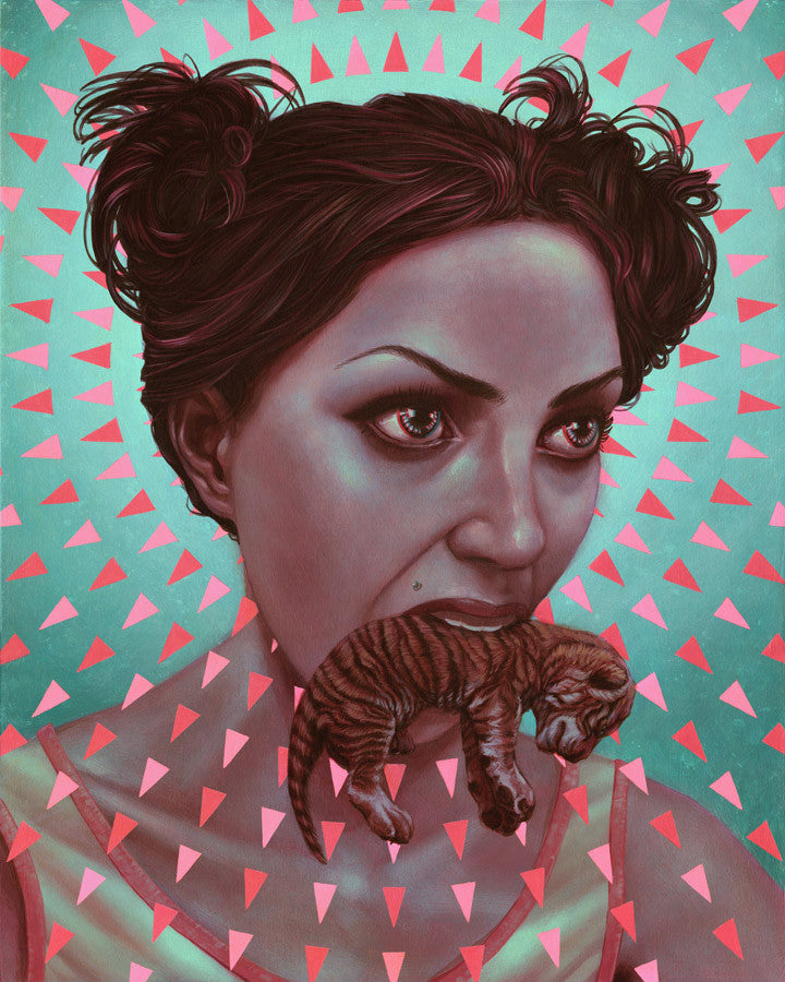 This Casey Weldon-inspired artwork features a woman with dark hair in buns, holding a small tiger cub in her mouth against a backdrop of radiant pink triangles. Its included in Spoke Art Gallerys At First Sight exhibit.