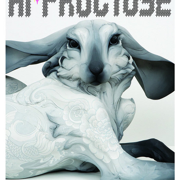 Hi-Fructose magazine, Volume 26, features a surreal sculpture of a reclining anthropomorphic rabbit adorned with intricate patterns, reminiscent of provocative paintings, set on a white background with the title at the top.