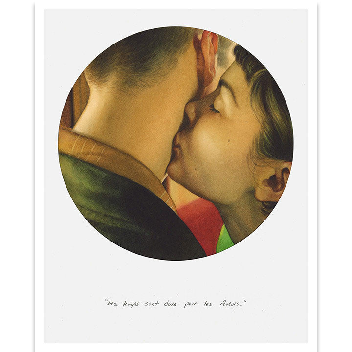 A woman with brown hair softly kisses a mans cheek, encased in a circular frame under UV-resistant plexiglass. Beneath it, French text says: Les temps sont durs pour les rêveurs. Enjoy custom framing options from Reuben Negron for dreamers who cherish tender moments.