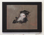Framed artwork by Allison Sommers, using gouache and mixed media, portrays an abstract dark organic skull-like form. Black swirls and red veins enliven the muted brown backdrop. Exhibited in Suggestivism: Resonance gallery with a small plaque beside it.