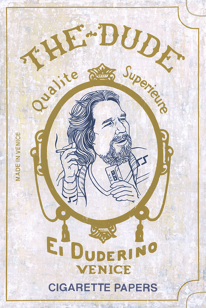A vintage-style illustration of a man graces The Dude package, labeled with Qualite Superieure, El Duderino, and Made in Venice. The ornate border showcases Casey Weldons flair, resembling acrylic on wood. Its nostalgic elegance feels like Quentin vs Coen.
