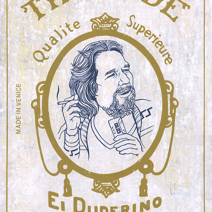 A vintage-style illustration of a man graces The Dude package, labeled with Qualite Superieure, El Duderino, and Made in Venice. The ornate border showcases Casey Weldons flair, resembling acrylic on wood. Its nostalgic elegance feels like Quentin vs Coen.