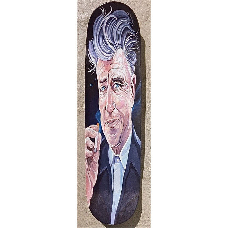 This Dave MacDowell illustrated skateboard deck features an older man with styled grey hair in a dark suit and white shirt, holding a cigarette. The acrylic portrait showcases expressive eyes and a slight smile against a neutral background.