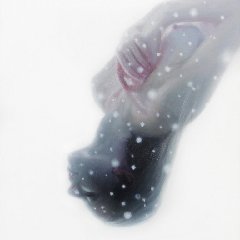 A dark-haired woman smiles serenely underwater, resembling a Henrik Uldalen painting. Her closed eyes and crossed arms enhance the tranquility as light and bubbles form a dreamy white haze around her.
