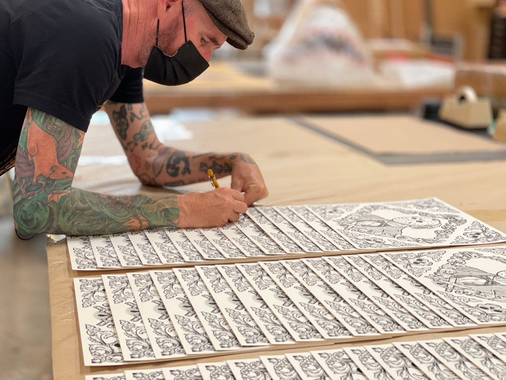 Artist Matt Ritchie signing his Horror Toile Jason screenprints