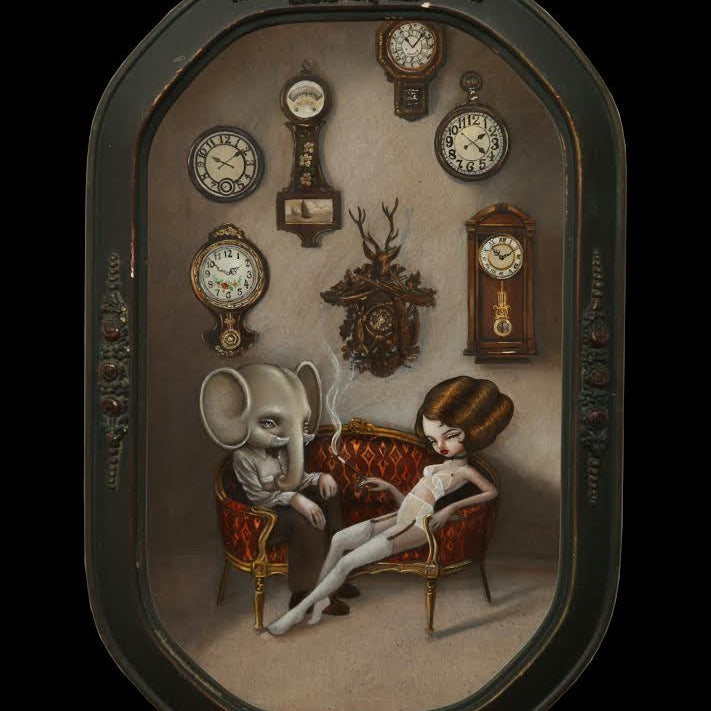 A surreal Kukula art piece depicts a woman with an intricate hairdo alongside a person with an elephant head on a red couch, set within an antique convex frame, surrounded by ornate wall clocks.