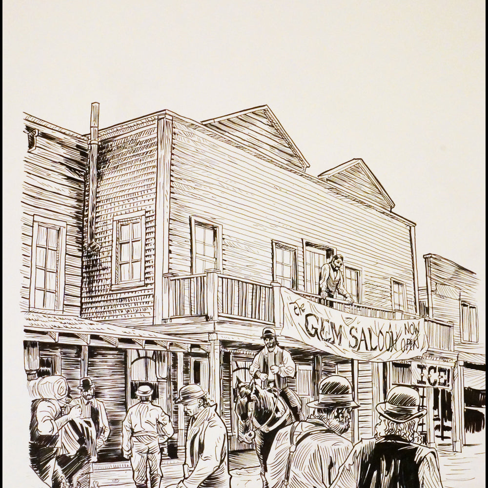 A framed artwork by Tim Doyle depicts an Old West street scene with wooden buildings. People in period attire gather as a man on horseback stands before The Gem Saloon, which has an Ice sign. The piece captures the lively essence of Doyles original pen and ink style.