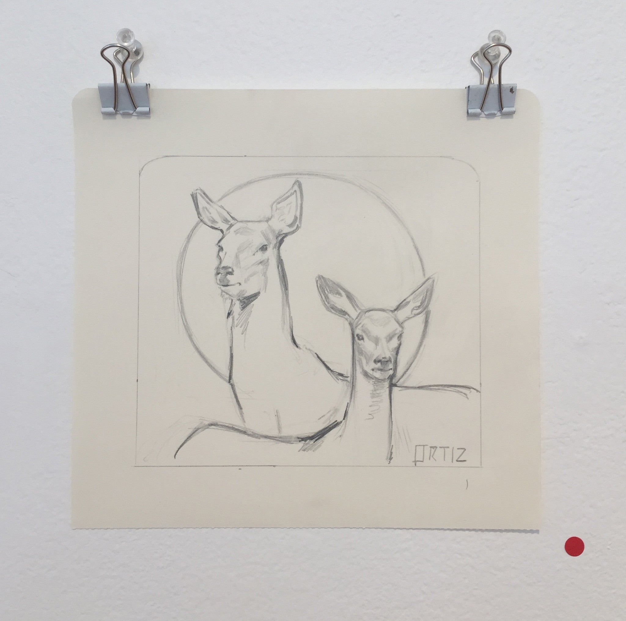 Ink and graphite sketch of two deer with large ears, one slightly taller, inside a rounded square; a circle behind them evokes Los Bocetos 7. Displayed on the wall in Karla Ortiz style.