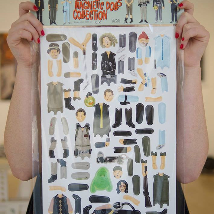 A person showcases a custom magnet set titled Bills Magnetic Dolls Collection with outfits and accessories inspired by Bill Murrays iconic roles, featuring styles from formal to casual. This unique product is offered by the brand name Max Dalton.