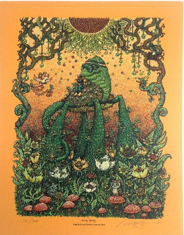 A Marq Spusta-inspired illustration showcases a whimsical, multi-eyed frog-like creature standing amidst plants. Its surrounded by mushrooms, flowers, and vines, while a bird flies nearby against a detailed orange backdrop—ideal for screen print enthusiasts looking for custom framing.