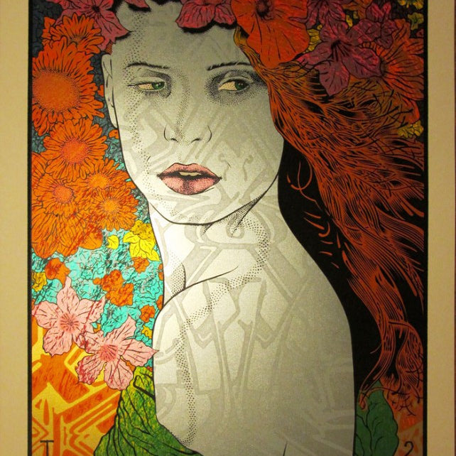 An artistic portrait by Chuck Sperry features a woman with long, flowing hair adorned with vibrant red, orange, and pink flowers. Dressed in green, she exudes classic rock poster art style against a lively 2013 background of colorful floral patterns.