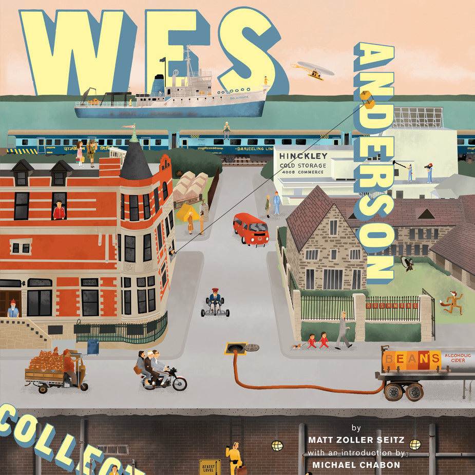 The illustrated cover of The Wes Anderson Collection by Matt Zoller Seitz features a whimsical town scene with a red brick building, a cyclist, and lively activities. The title and authors name prominently offer insight into Wes Andersons filmography and behind-the-scenes photos.