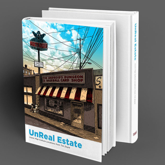 The hardcover book UnReal Estate by Tim Doyle showcases a cover illustration of The Androids Dungeon & Baseball Card Shop, featuring a red and white awning, a bat logo sign, and a clear blue sky backdrop. The book is enticingly open.