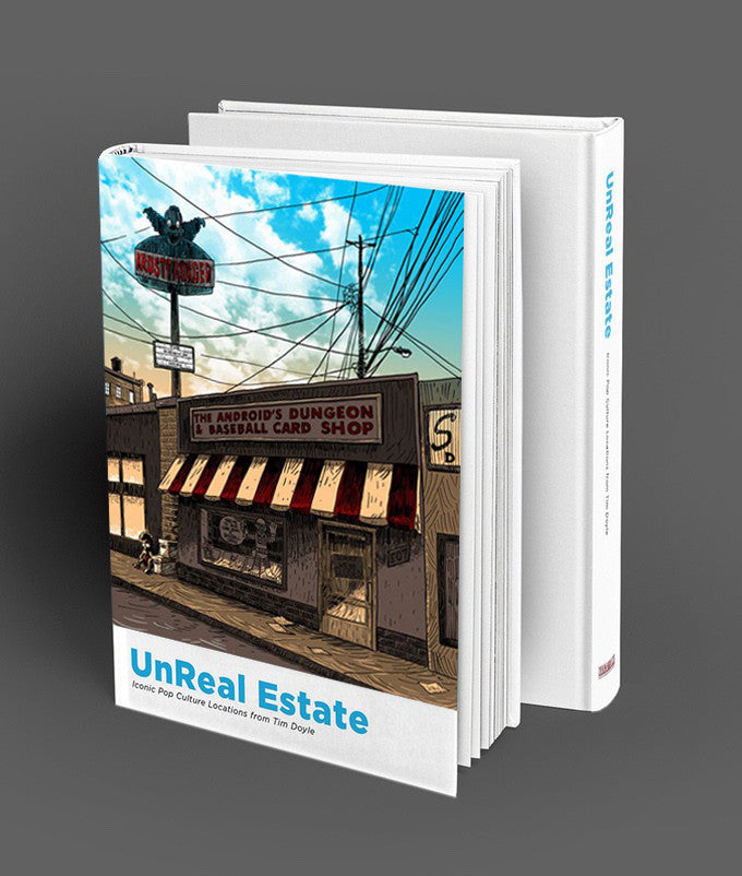 The hardcover book UnReal Estate by Tim Doyle showcases a cover illustration of The Androids Dungeon & Baseball Card Shop, featuring a red and white awning, a bat logo sign, and a clear blue sky backdrop. The book is enticingly open.