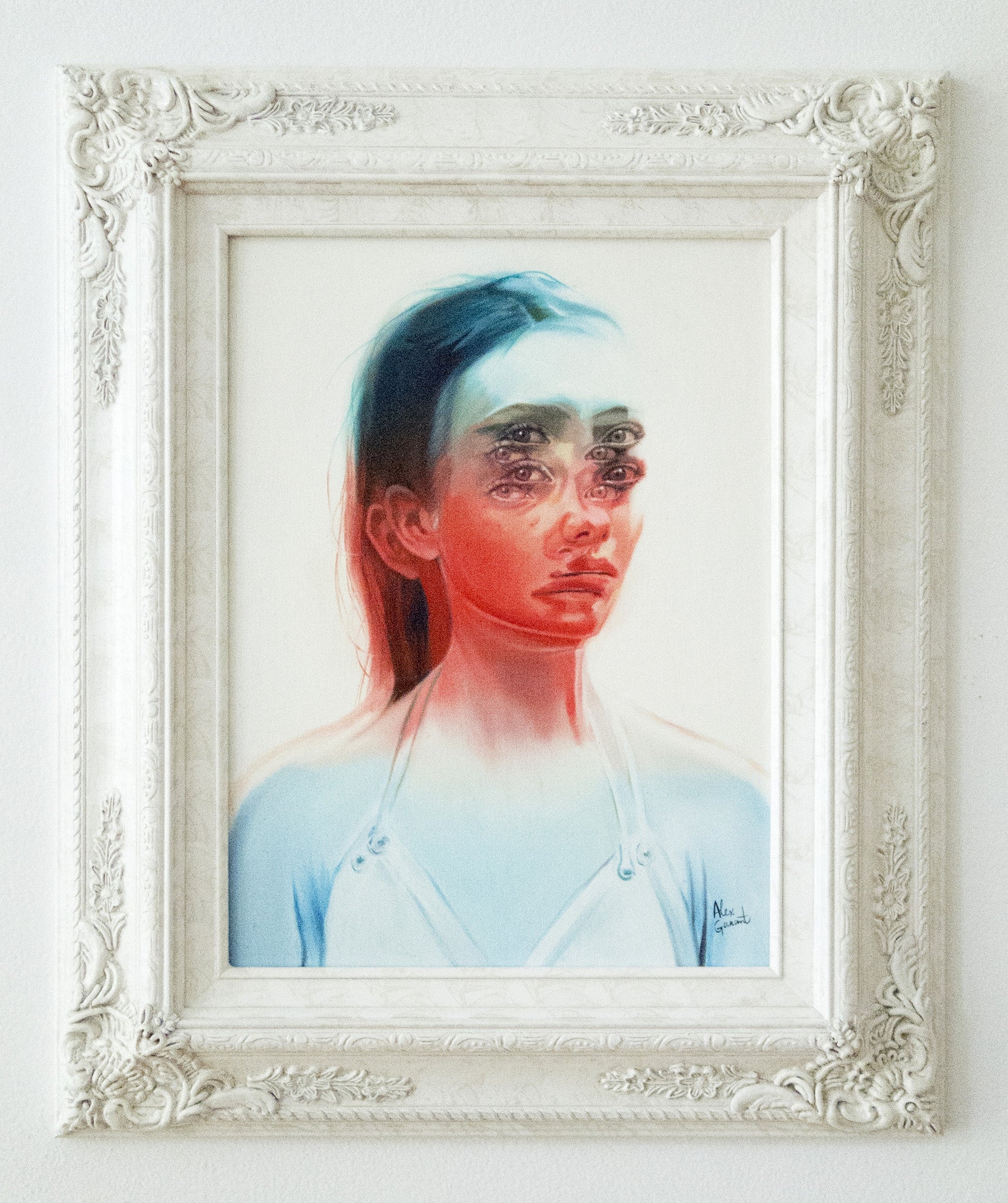 An oil on canvas painting by Alex Garant features a woman with multiple eyes and a distorted face. Bold red and blue tones impart a ghostly effect, framed in an intricate white vintage-style frame. Art enthusiasts can opt for flexible payment plans.