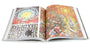 An open art book displays pages brimming with vibrant geometric patterns. The left page has Oliver Vernon-like triangular designs and a yellow face, while the right side reflects Mars-1s brand with a vivid mosaic of intricate shapes and colors.