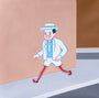 A cartoonish character in a light blue suit and hat, inspired by Joan Cornellàs style, cheerfully walks on an acrylic on canvas scene. The figure features hairy red legs with clawed feet against a peach-colored wall and sidewalk.