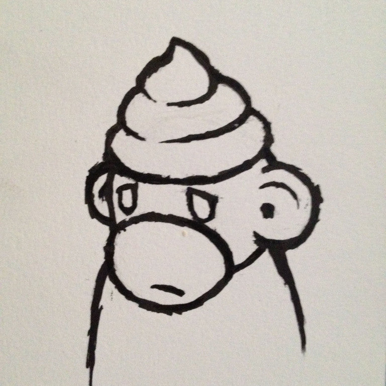 A framed black and white line art drawing by Luke Chueh depicts a cartoon monkey with an ice cream cone hat, combining whimsy and intrigue with its neutral expression.