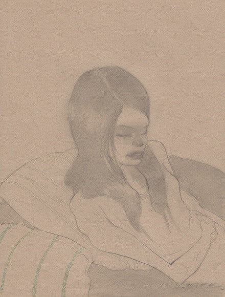 A young girl with long hair is shown in this graphite on paper artwork, created in the style of Sam Wolfe Connelly. She sits peacefully with eyes closed, enveloped in a light blanket and leaning against striped cushions.