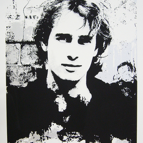 John Graysons limited edition screen print features a monochromatic portrait of a person with wavy hair against a textured background. High contrast black and white blend to create an abstract effect, evoking the ethereal aura associated with Jeff Buckley.