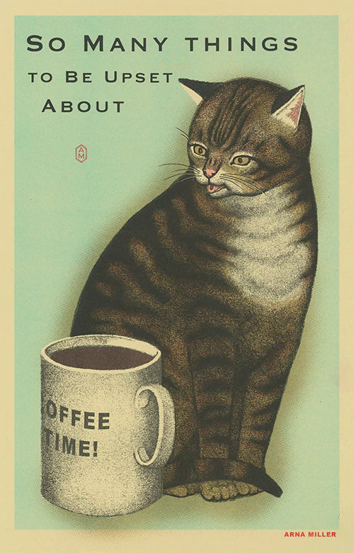 striped cat looking at full coffee cup with text above "So many things to be upset about"