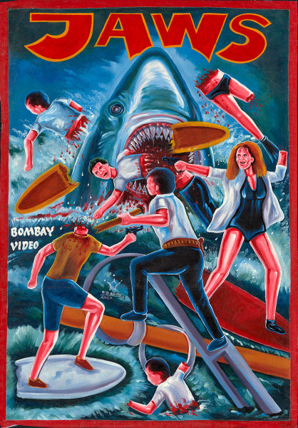 A hand-painted Deadly Prey movie poster in oil and enamel on flour sack shows a giant shark attacking panicked swimmers amid blood and chaos. "JAWS" is boldly at the top, with BOMBAY VIDEO on the left.