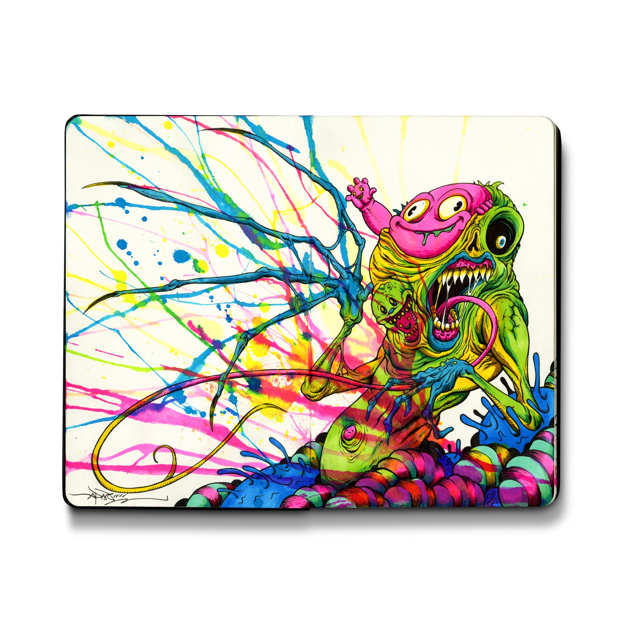 colorful painting in an open face Moleskine notebook of an alien-like creature with various faces emerging from its green body by artist Alex Pardee