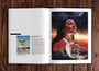 An open Paragon Books art book on a wooden table displays intriguing artwork. The left page features a surreal painting with artist details, while the right has a fine art portrait of a woman, accompanied by text saying Shes an experiment and Poor Things, resembling a movie poster.