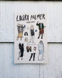 Laura Palmer paper doll set on a wooden surface