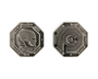 Two octagonal metal tokens by Bruce Yan: one features a helmeted figure with the text “CCP Police token 001 DEAD OR ALIVE,” and the other displays a maze-like pattern with $1 at the center and edge text.